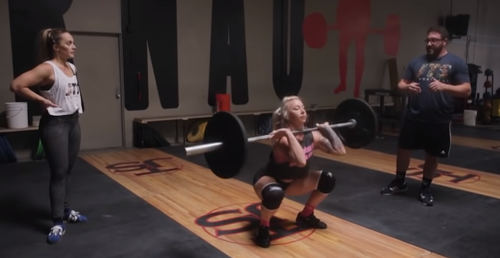 training weightlifting, two womens and one man