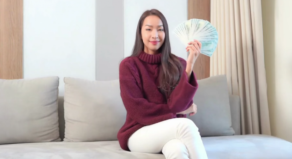 woman with dollars in hand
